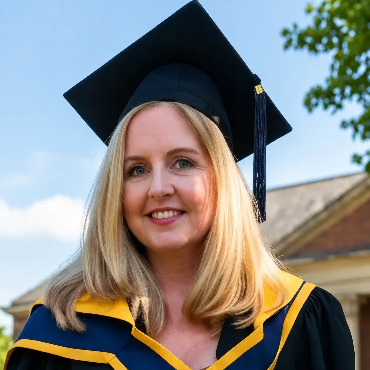 Teacher Sandra wearing academic graduation attire